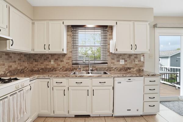1547 West 99th Avenue Crown Point, IN 46307 - Photo 6 of 21 a kitchen with granite countertop white cabinets and sink