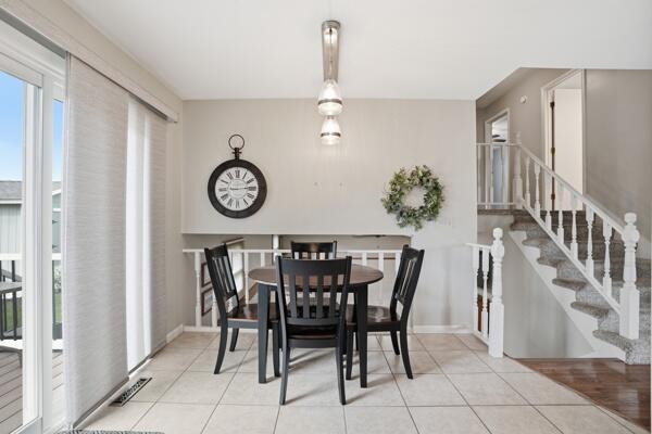 1547 West 99th Avenue Crown Point, IN 46307 - Photo 7 of 21 a view of a dining table and chairs in a room