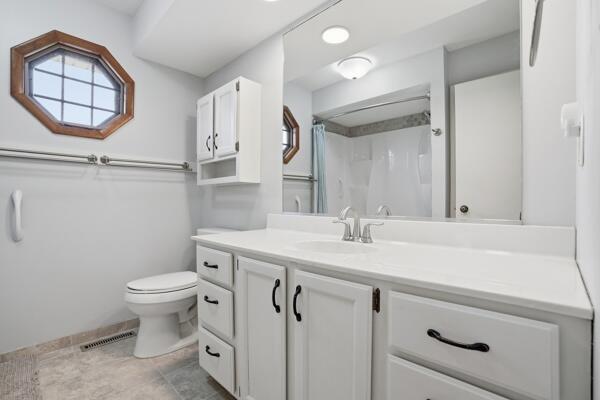 1547 West 99th Avenue Crown Point, IN 46307 - Photo 10 of 21 a bathroom with a sink a toilet and a mirror