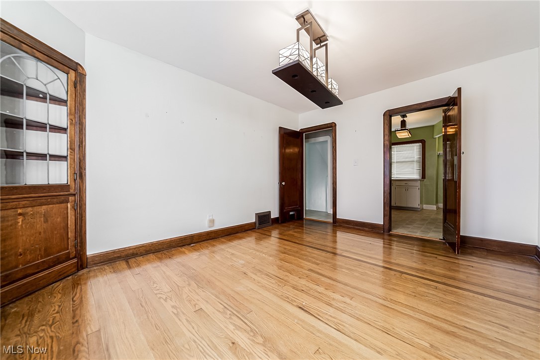 6711 Forest Avenue Parma, OH 44129 - Photo 10 of 33 Empty room featuring light wood-type flooring and baseboards