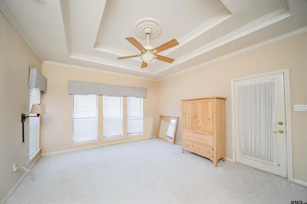a spacious bathroom with a sink a large mirror and shower