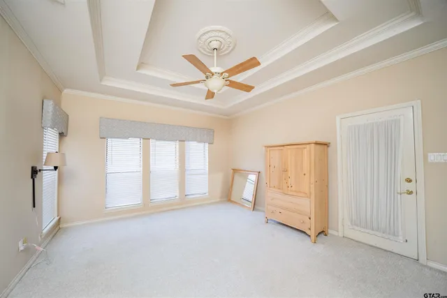 a spacious bathroom with a sink a large mirror and shower