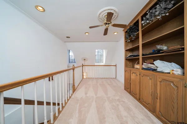 a spacious bathroom with double sink a mirror a double vanity and a