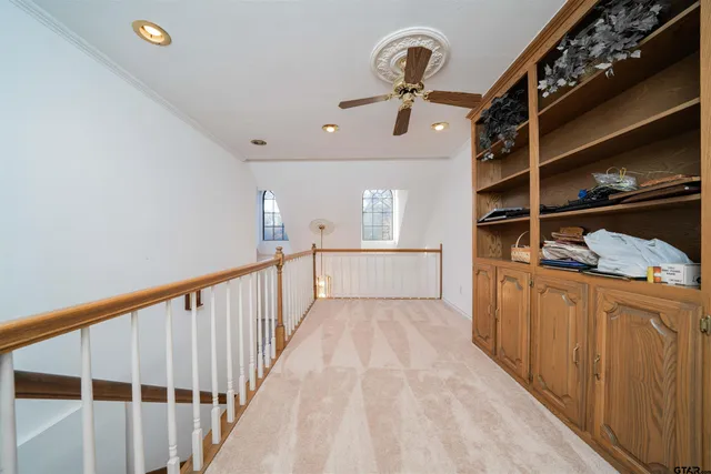 a spacious bathroom with double sink a mirror a double vanity and a