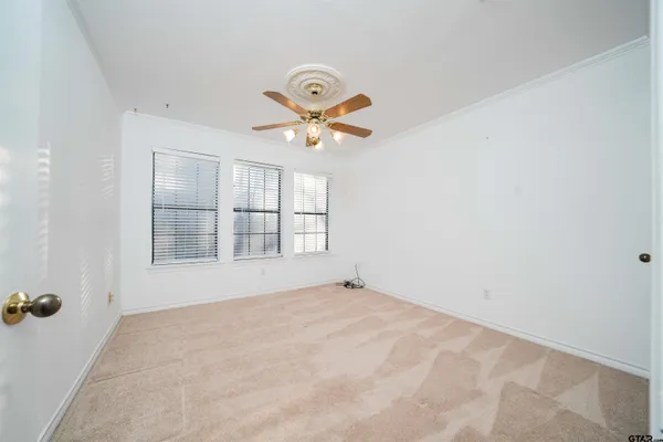 a view of a big room with carpet