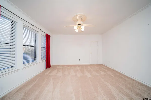 a view of a house with a yard and garage