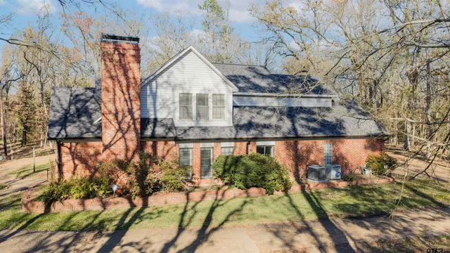 a view of a house with a yard and garage