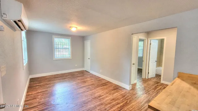 a view of livingroom with hardwood floor and hallway