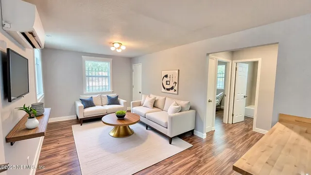 a living room with furniture and a flat screen tv