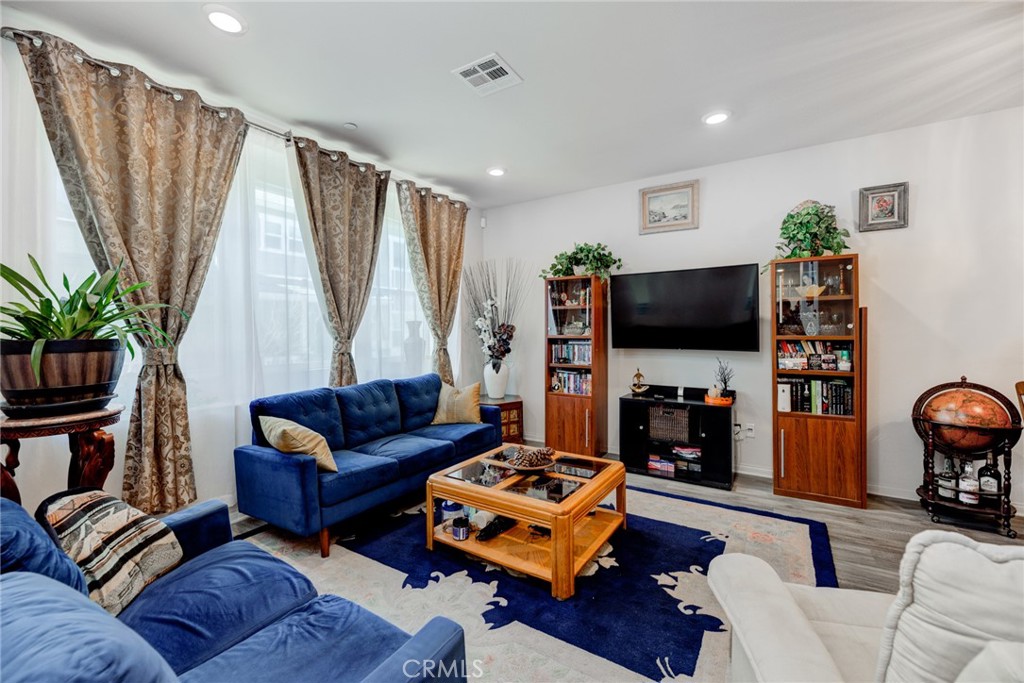 11 Lilac Lane Compton, CA 90221 - Photo 15 of 49 a living room with furniture and a flat screen tv