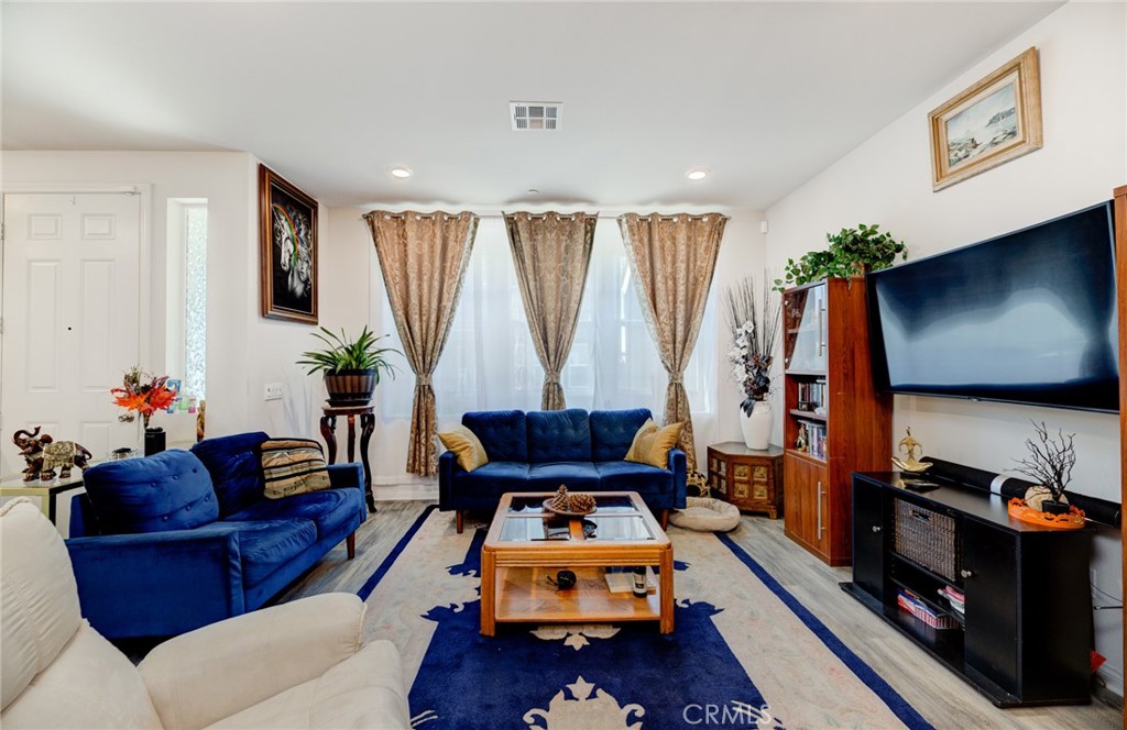 11 Lilac Lane Compton, CA 90221 - Photo 16 of 49 a living room with furniture and a flat screen tv