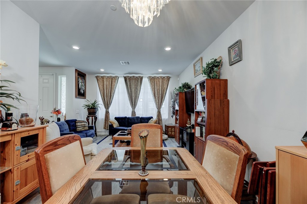 11 Lilac Lane Compton, CA 90221 - Photo 17 of 49 a living room with furniture a large window and gym equipment