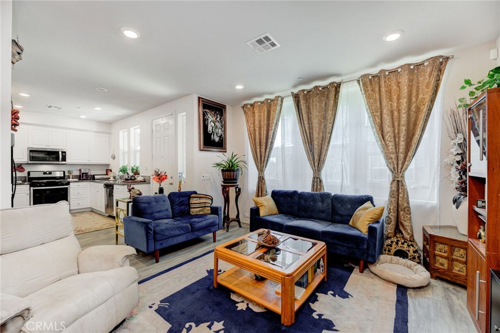 11 Lilac Lane Compton, CA 90221 - Photo 20 of 49 a living room with furniture a couch and a flat screen tv