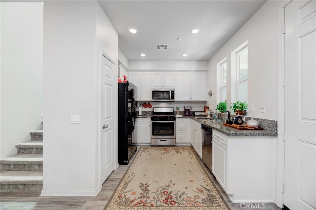 11 Lilac Lane Compton, CA 90221 - Photo 24 of 49 a kitchen with a sink stainless steel appliances and cabinets