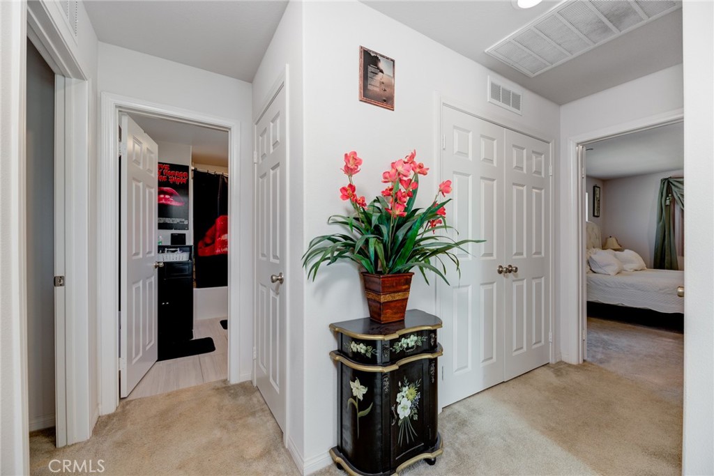 11 Lilac Lane Compton, CA 90221 - Photo 25 of 49 a view of a hallway with wooden floor and a potted plant