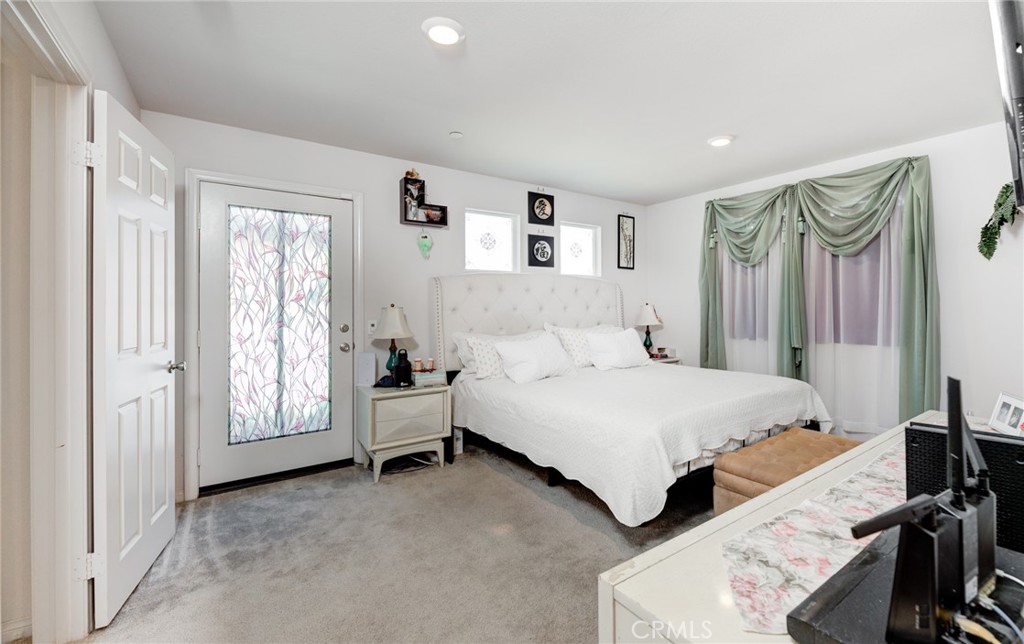 11 Lilac Lane Compton, CA 90221 - Photo 27 of 49 a spacious bedroom with a bed and a couch