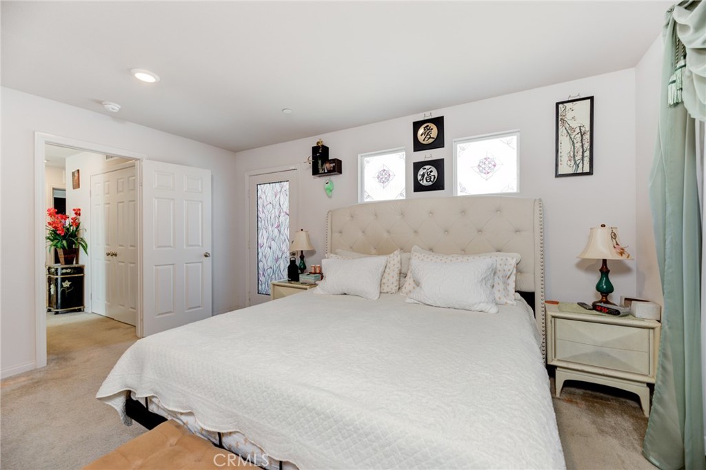 11 Lilac Lane Compton, CA 90221 - Photo 28 of 49 a bedroom with a bed and a couch