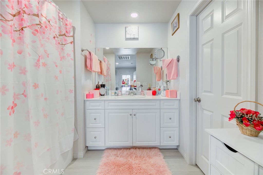 11 Lilac Lane Compton, CA 90221 - Photo 30 of 49 a bathroom with a sink vanity and mirror