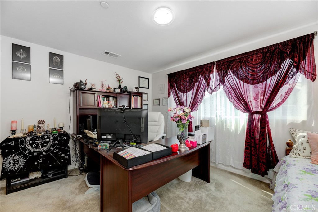 11 Lilac Lane Compton, CA 90221 - Photo 32 of 49 a room with furniture and a flat screen tv