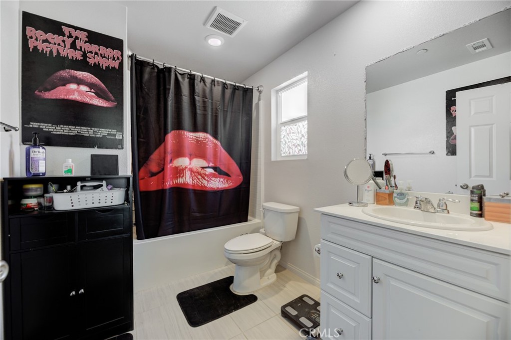 11 Lilac Lane Compton, CA 90221 - Photo 34 of 49 a bathroom with a sink vanity mirror and toilet