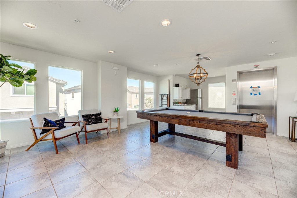 11 Lilac Lane Compton, CA 90221 - Photo 39 of 49 a living room with furniture a table and a potted plant