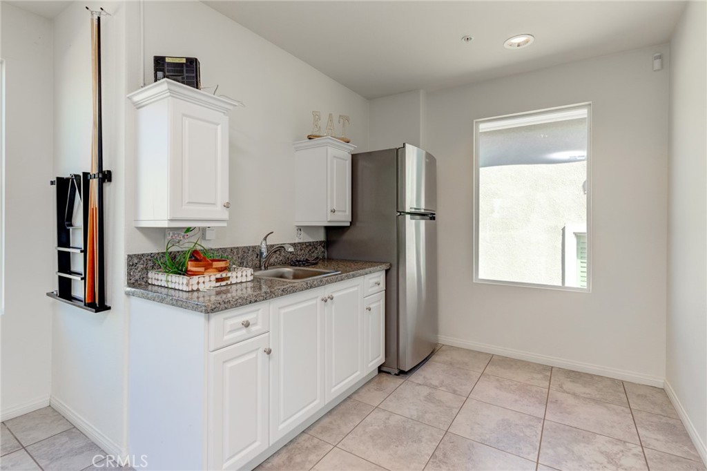 11 Lilac Lane Compton, CA 90221 - Photo 43 of 49 a kitchen with stainless steel appliances granite countertop a refrigerator and a stove