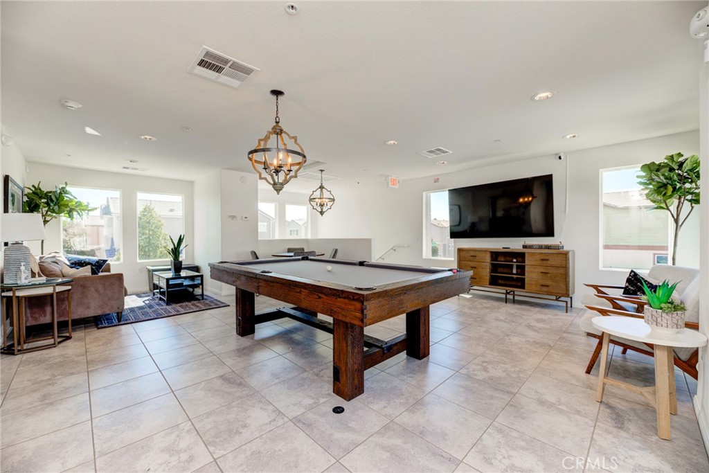 11 Lilac Lane Compton, CA 90221 - Photo 45 of 49 a living room with furniture a flat screen tv and a dining table