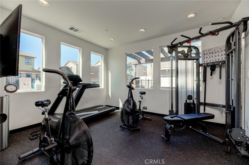 11 Lilac Lane Compton, CA 90221 - Photo 47 of 49 a room with gym equipment and a large window