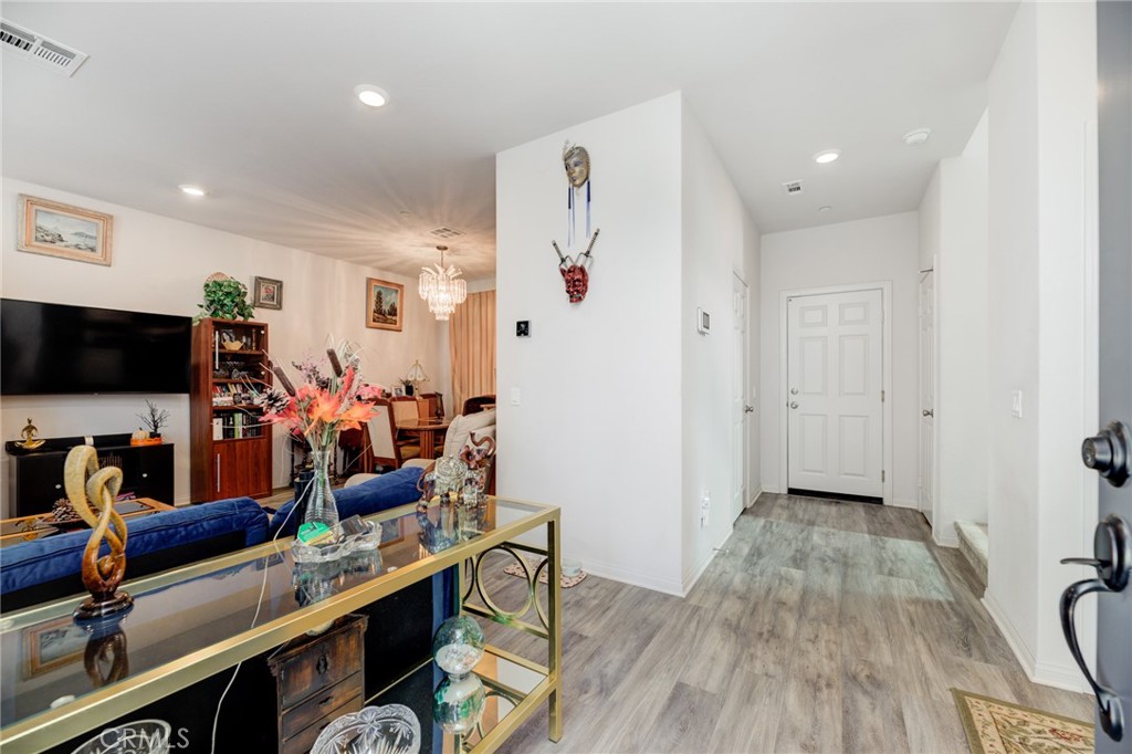 11 Lilac Lane Compton, CA 90221 - Photo 9 of 49 a view of a workspace with furniture and wooden floor
