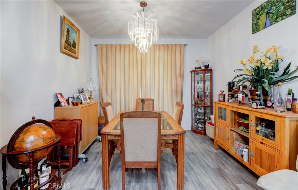 11 Lilac Lane Compton, CA 90221 - Photo 10 of 49 a view of a dining room with furniture and wooden floor