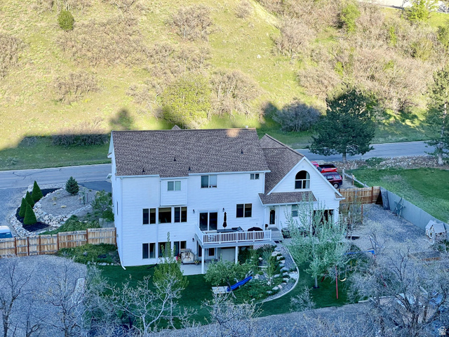 387 North Loafer Canyon Road Payson, UT 84651 - Photo 89 of 94 White exterior home with multiple large windows and a peaked roofline