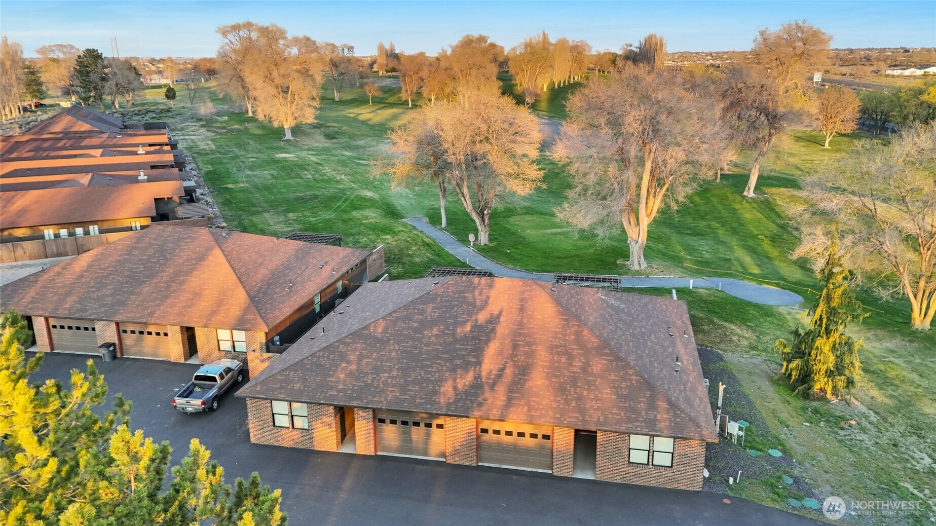 1213 Rd F .2 Northeast, Unit A&B Moses Lake, WA 98837 - Photo 1 of 37 an aerial view of multiple houses with a yard