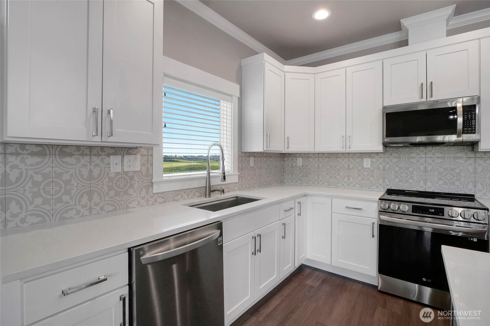 1213 Rd F .2 Northeast, Unit A&B Moses Lake, WA 98837 - Photo 21 of 37 a kitchen with appliances cabinets and a wooden floor