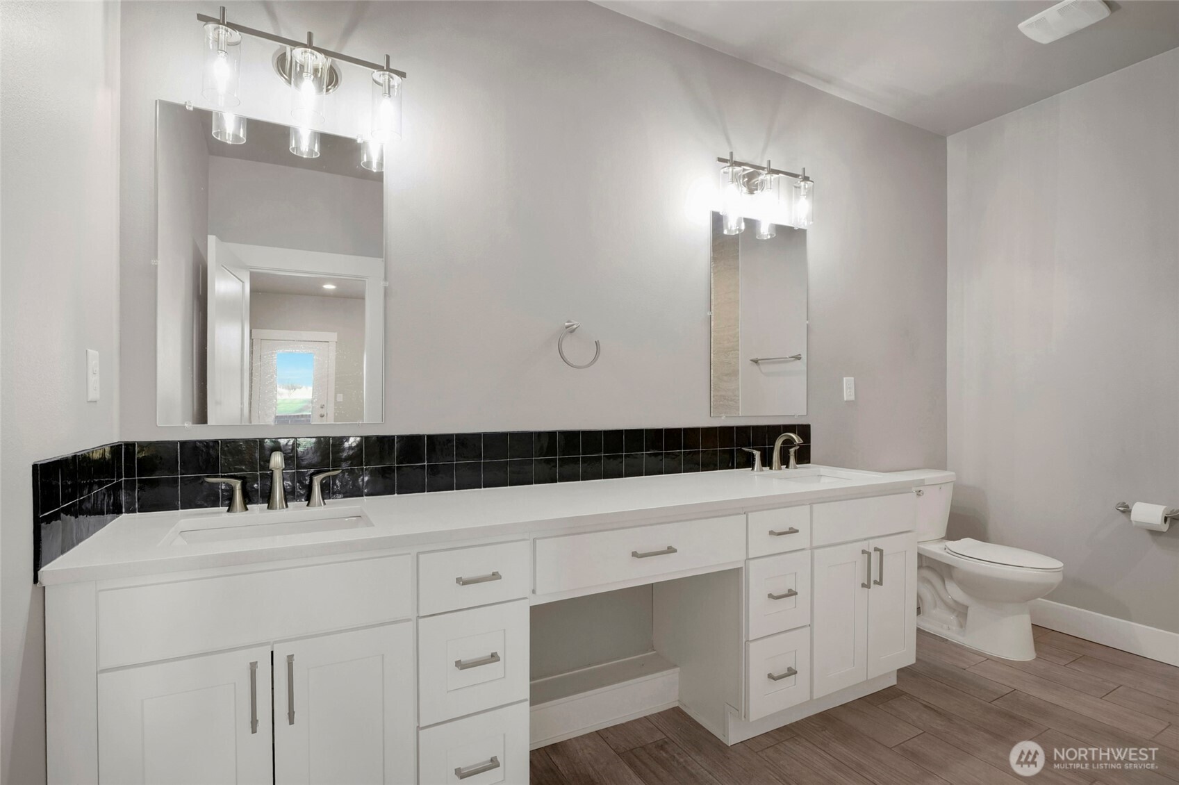 1213 Rd F .2 Northeast, Unit A&B Moses Lake, WA 98837 - Photo 24 of 37 a bathroom with a double vanity sink and a toilet