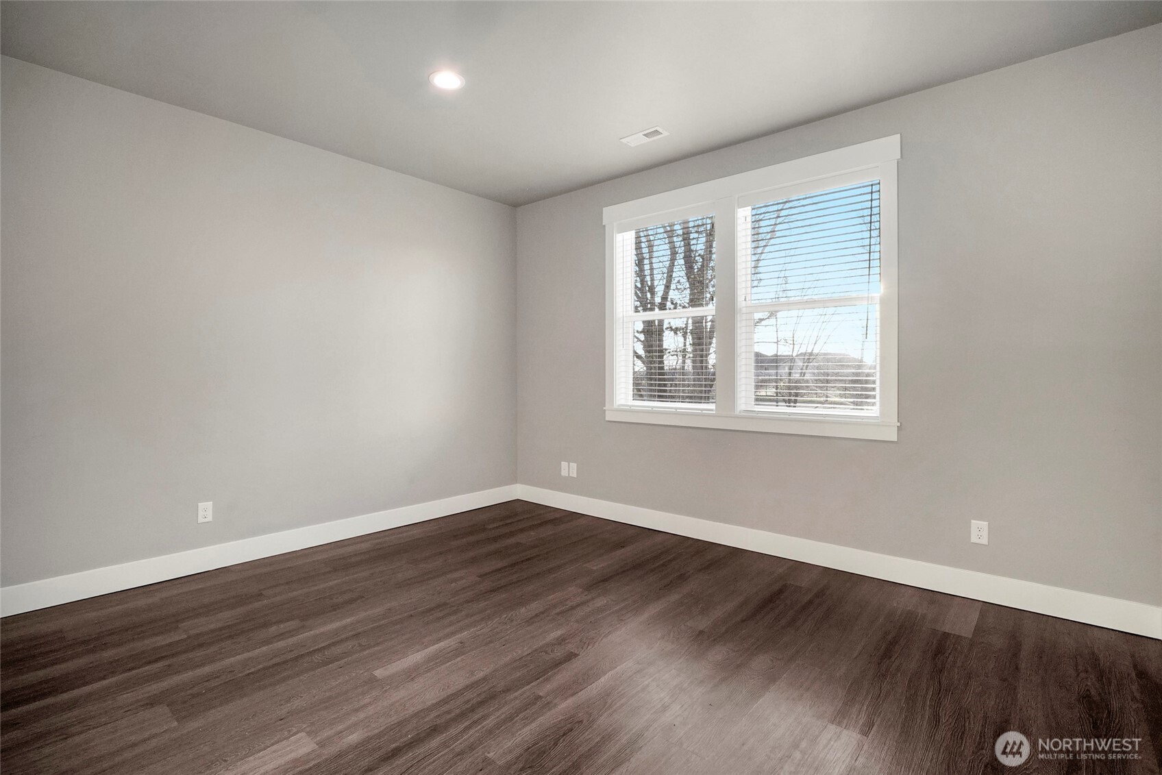 1213 Rd F .2 Northeast, Unit A&B Moses Lake, WA 98837 - Photo 30 of 37 a view of an empty room with wooden floor and a window