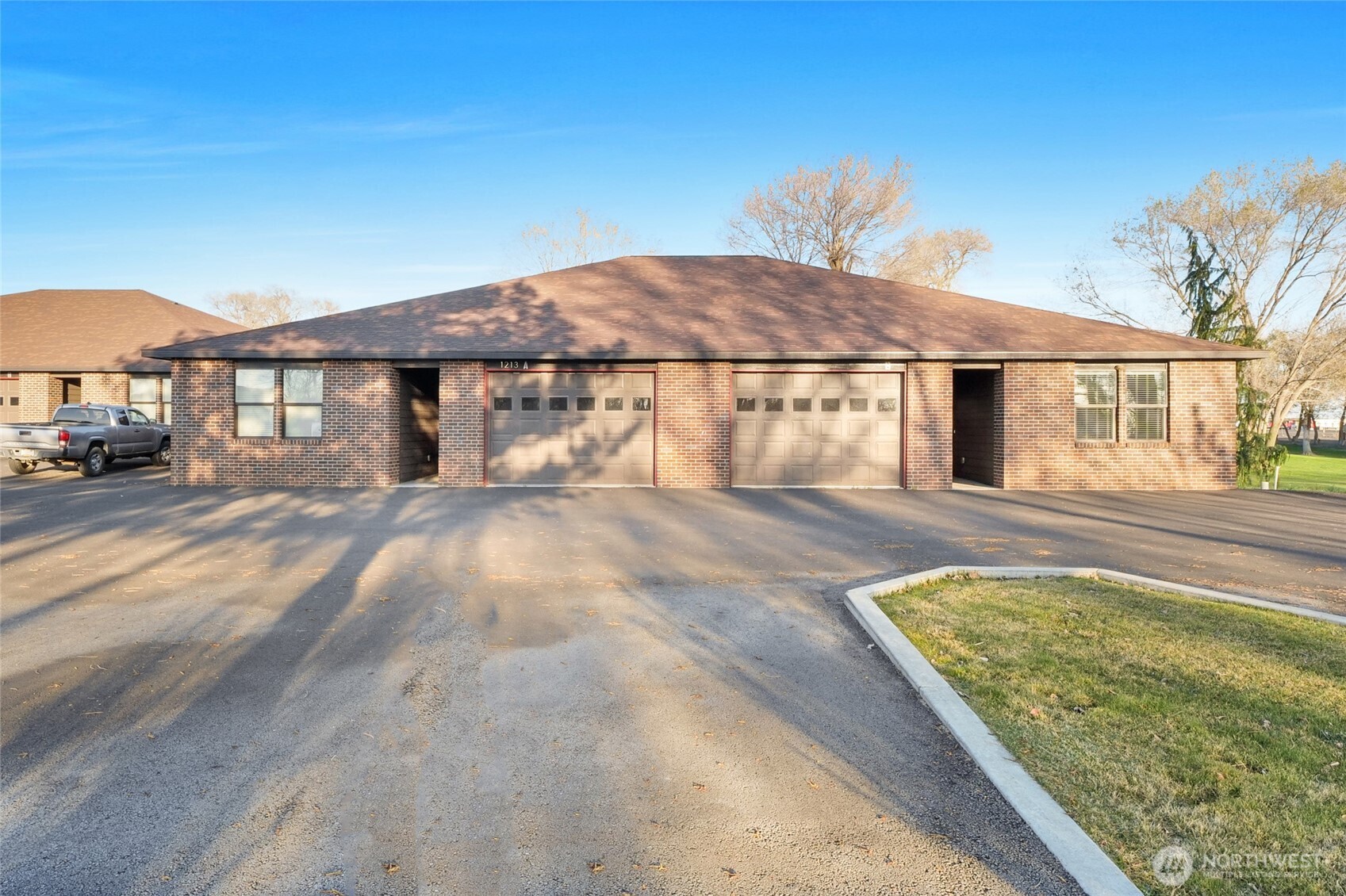 1213 Rd F .2 Northeast, Unit A&B Moses Lake, WA 98837 - Photo 5 of 37 a view of a house with a yard
