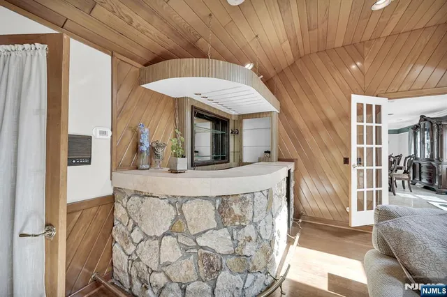a view of living room kitchen with furniture and fireplace