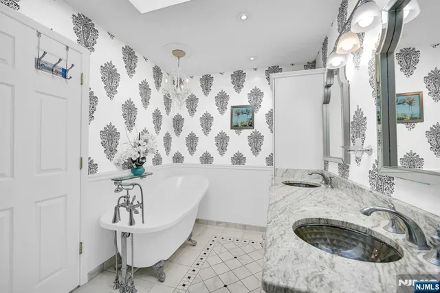 a bath room with a sink and a tub