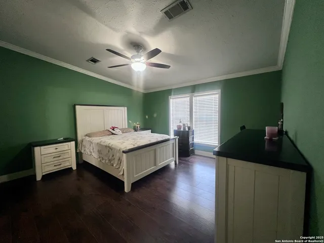 a bed room with a bed and a chandelier