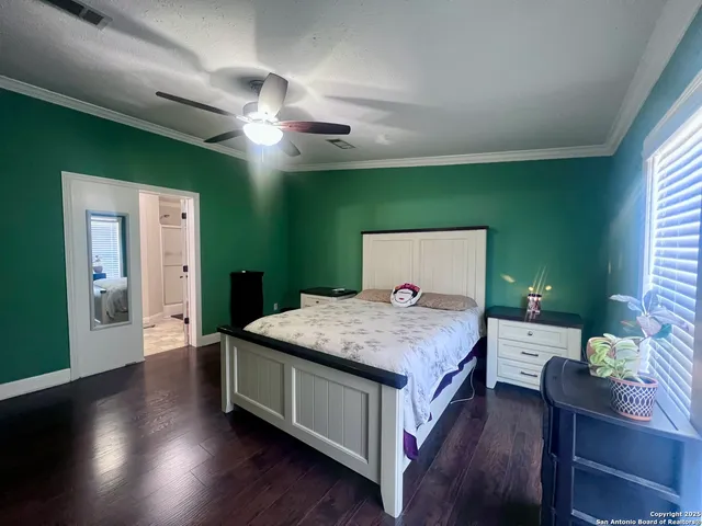 a bedroom with a bed and a table