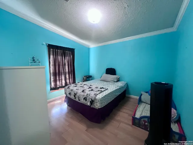 a reading room with furniture and wooden floor