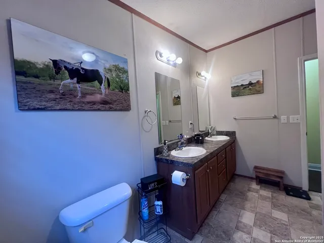 a kitchen with a stove top oven and cabinets