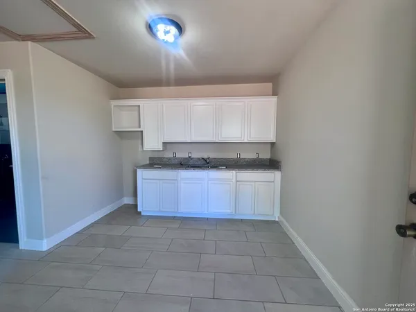 a view of a workspace with furniture