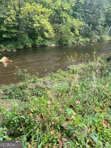 a view of a lake with top of green space