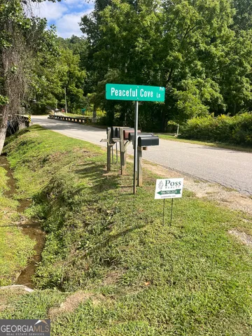 a swimming pool with outdoor seating and yard