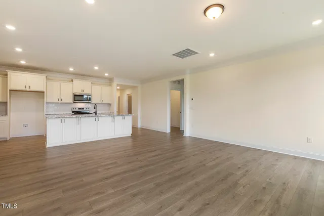a view of kitchen with wooden floor