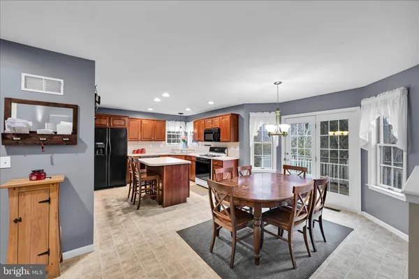 a view of a dining room with furniture