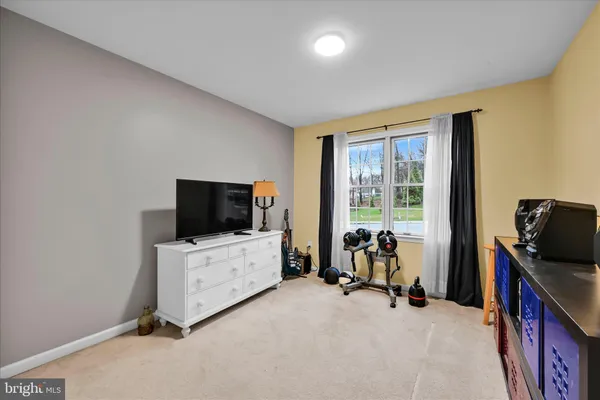 a living room with furniture and flat screen tv