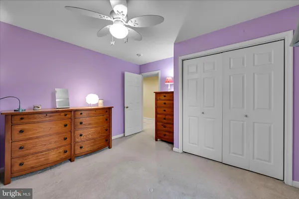 a view of an empty room with a cabinet