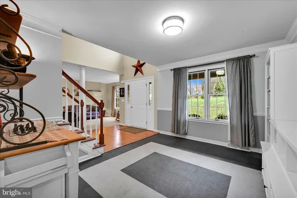 a view of an entryway with wooden floor